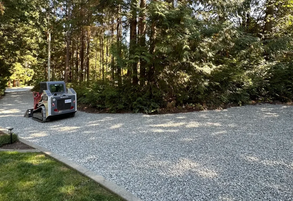 Skidsteer driveway Skidsteer working on driveway